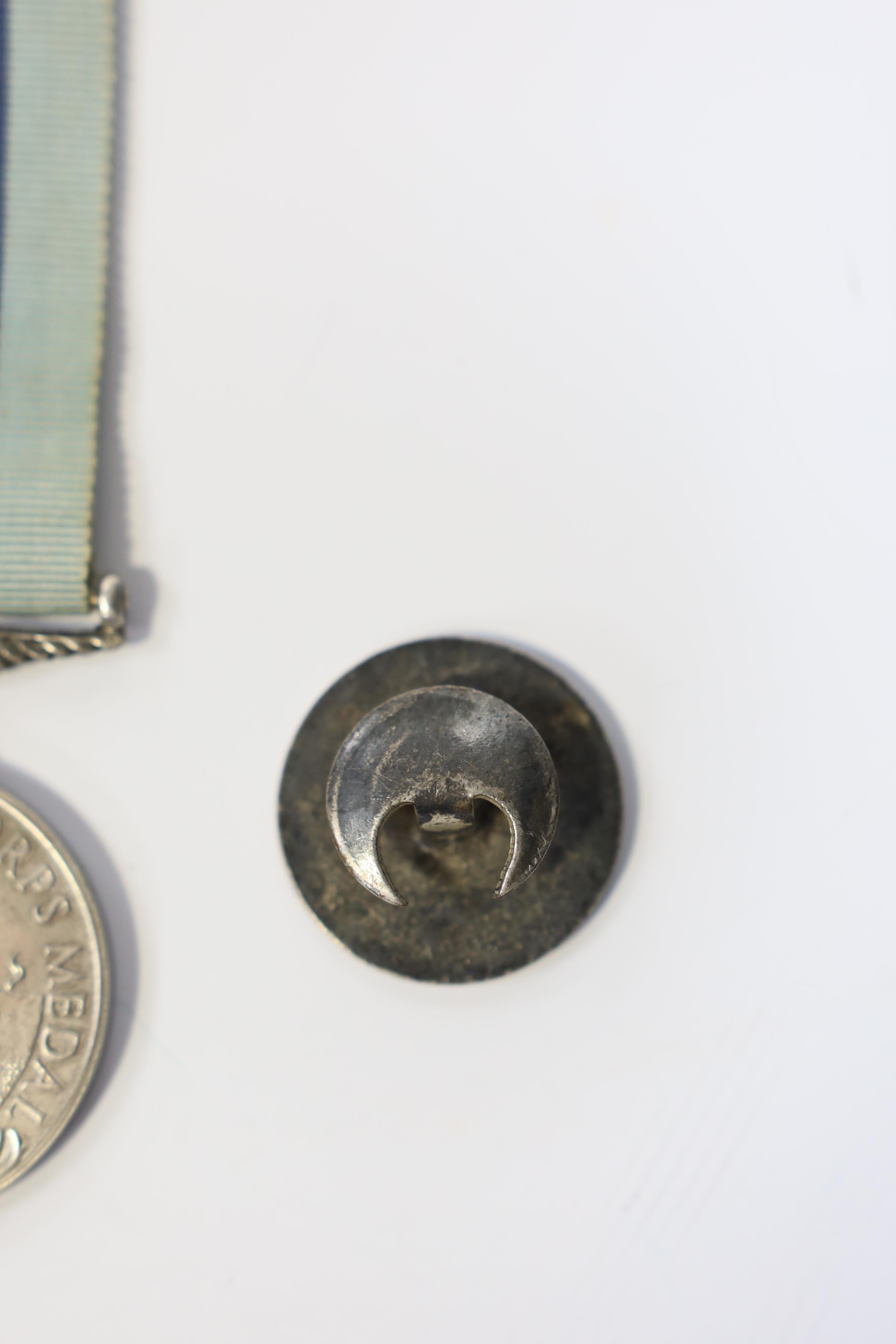 An ERII (B) Royal Observer Corps medal to Observer W.Cook with a lapel badge. Condition - fair.